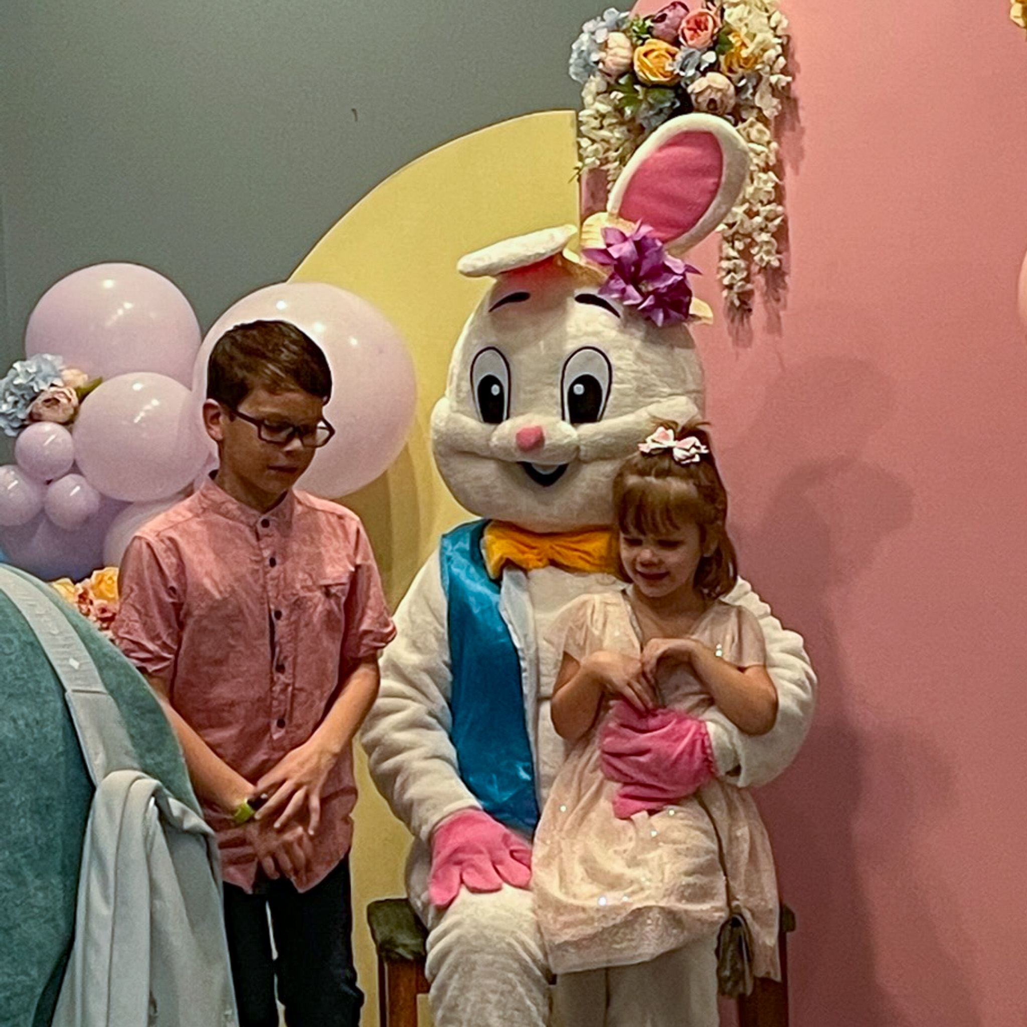 Children pose with Easter bunny at Moving the Mitten Easter Egg Hunt