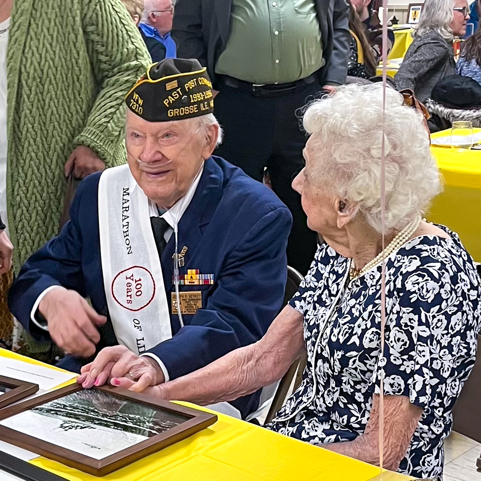 WWII Veteran Joseph Berkey sits with wife Ann at his 100th birthday celebration.