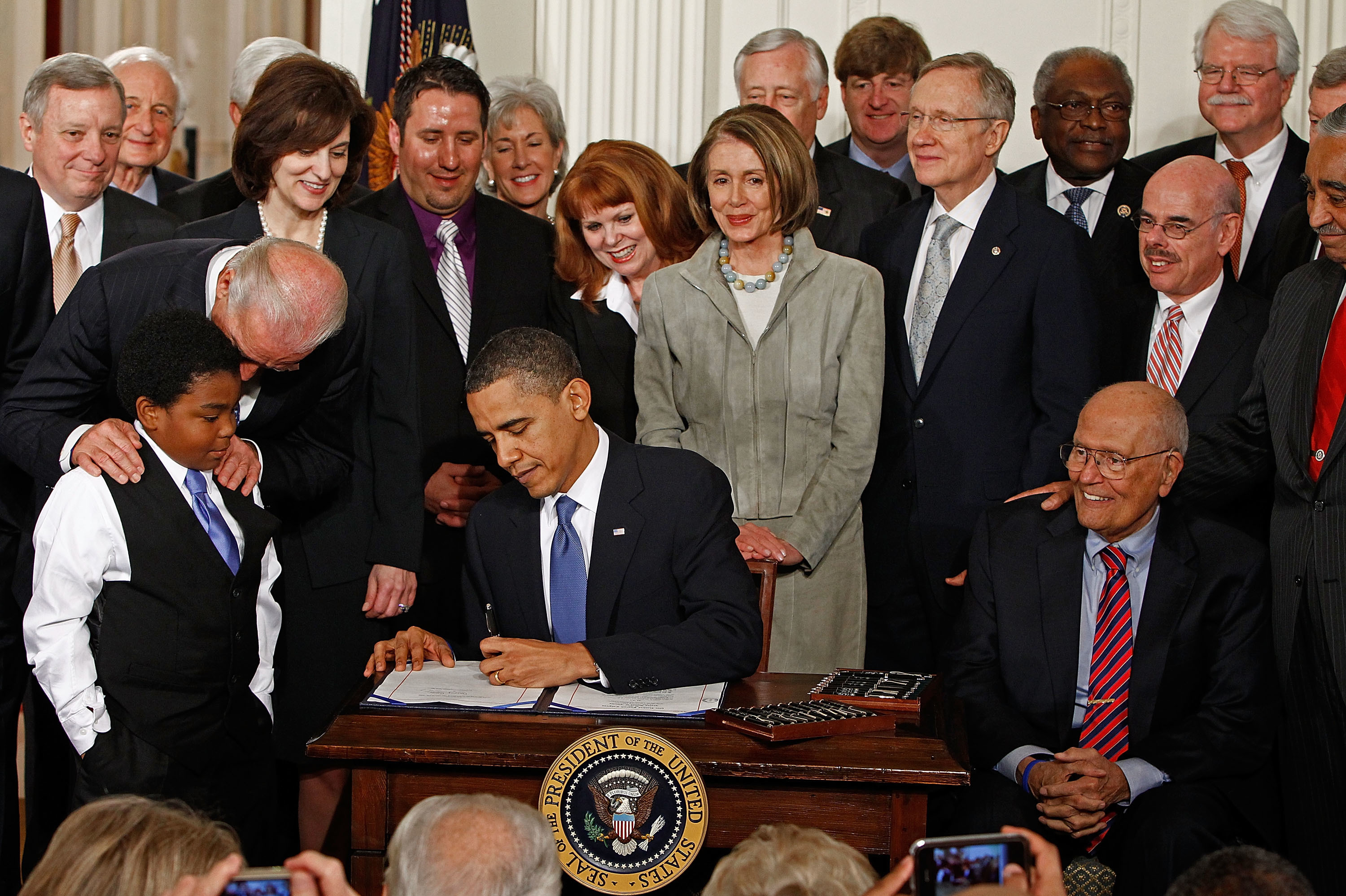 John Dingell sits by President Obama's side at Affordable Care Act signing