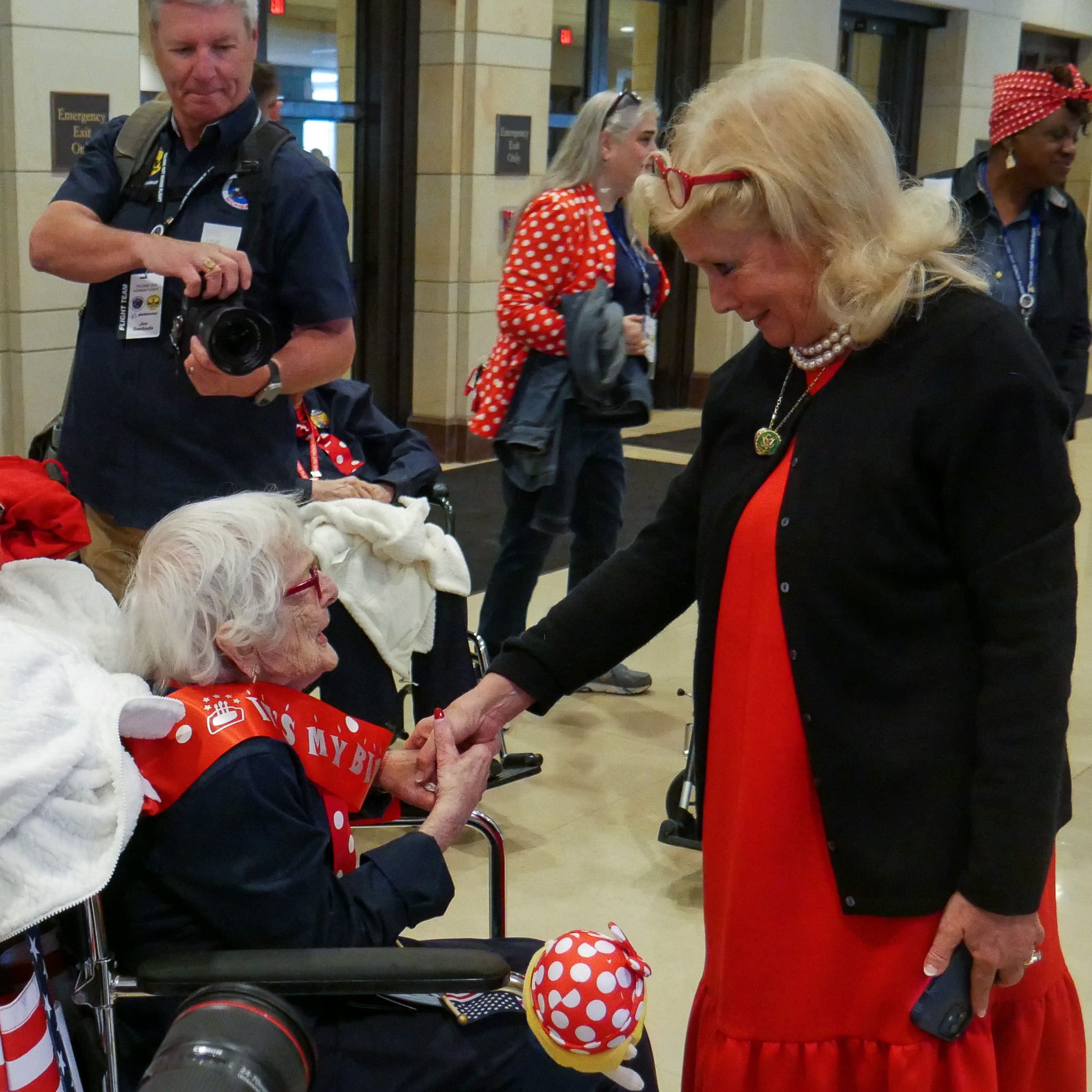 Rep. Dingell visits with Rosie celebrating her birthday on this year's Honor Flight