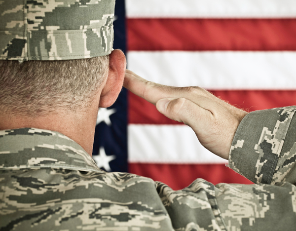 Military soldier saluting American flag Military soldier saluting American flag